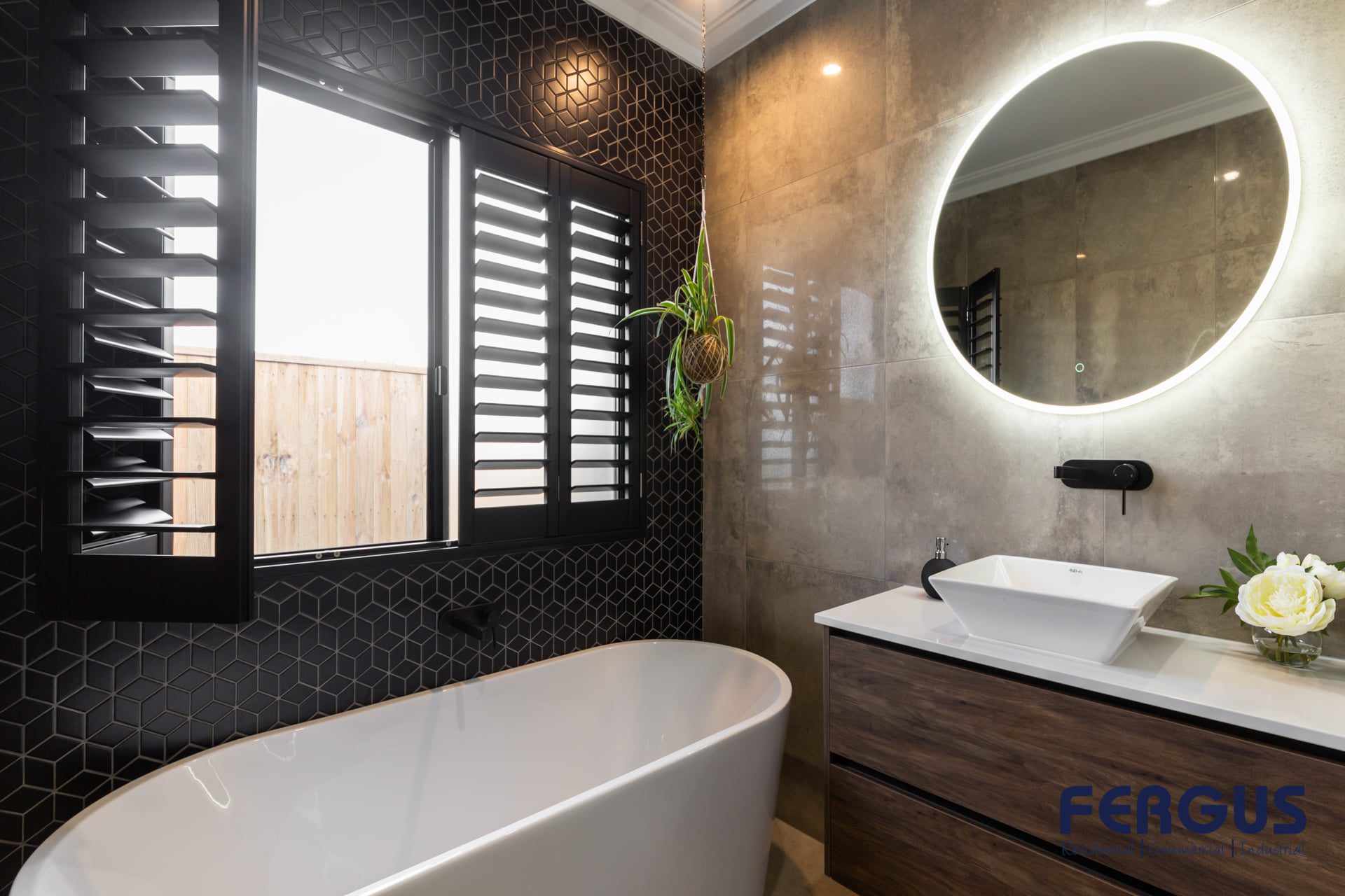 Ella 452 Residential Bathroom Design featuring a meticulously crafted vanity cabinet with sink & mirror & bathtub by Fergus Builders Residential, Industrial & Commercial real estate development Mackay
