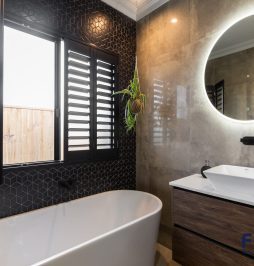 Ella 452 Residential Bathroom Design featuring a meticulously crafted vanity cabinet with sink & mirror & bathtub by Fergus Builders Residential, Industrial & Commercial real estate development Mackay