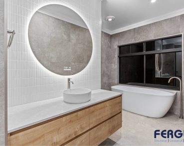 Residential Bathroom Design featuring a meticulously crafted vanity cabinet with sink & mirror & Bathtub by Fergus Builders Residential, Industrial & Commercial real estate development Mackay