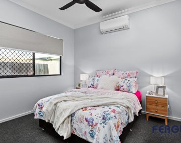 Residential Bedroom design, complete with a thoughtfully integrated sliding window by Fergus Builders Residential, Industrial & Commercial real estate development Mackay