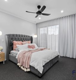 Residential Bedroom design, complete with a thoughtfully integrated TV unit and AC by Fergus Builders Residential, Industrial & Commercial real estate development Mackay