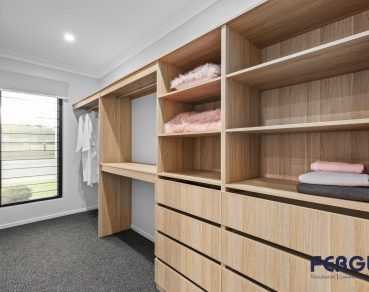 Residential Bedroom design, complete with a thoughtfully integrated built in cabinet by Fergus Builders Residential, Industrial & Commercial real estate development Mackay