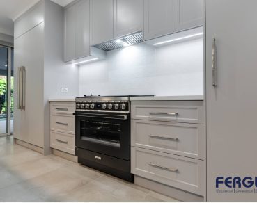 Residential Kitchen & Dining Area design showcasing a seamlessly integrated built-in cabinet & gas stove & range hood by Fergus Builders Residential, Industrial & Commercial real estate development Mackay