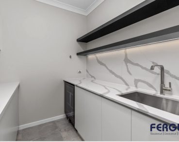 Residential Prep Kitchen design showcasing a seamlessly integrated built-in cabinet & sink by Fergus Builders Residential, Industrial & Commercial real estate development Mackay