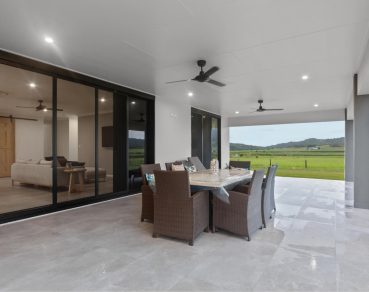Residential Outdoor Living Area with Black Framed Bifold Doors design by Fergus Builders Residential, Industrial & Commercial real estate development Mackay